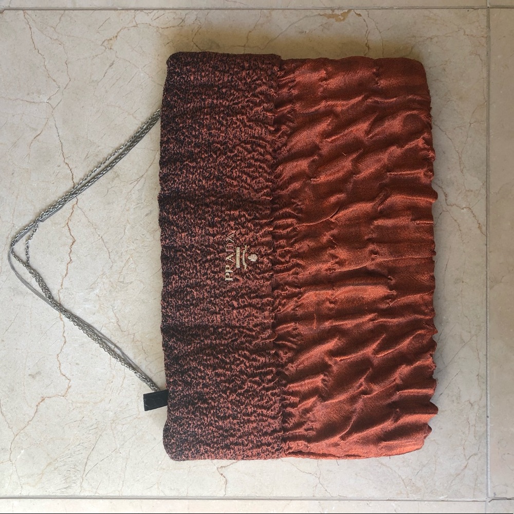 Prada burnt orange envelope bag with chain